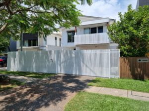 distance view - vertical batten fence with sliding gate and ped gate and balustrade