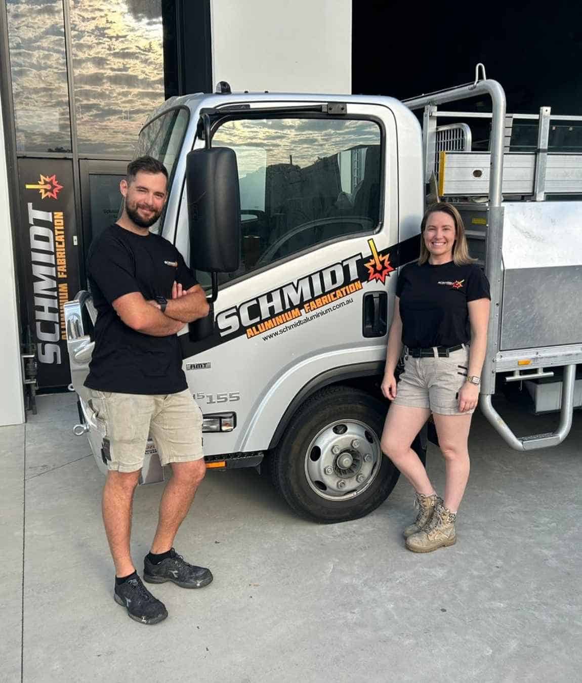 Daniel and Erin team photo in front of schmidt aluminium truck